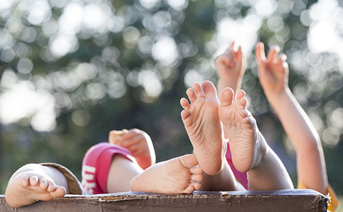 children lying outside children lying outside