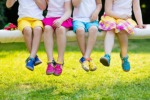 children sitting on bench children sitting on bench