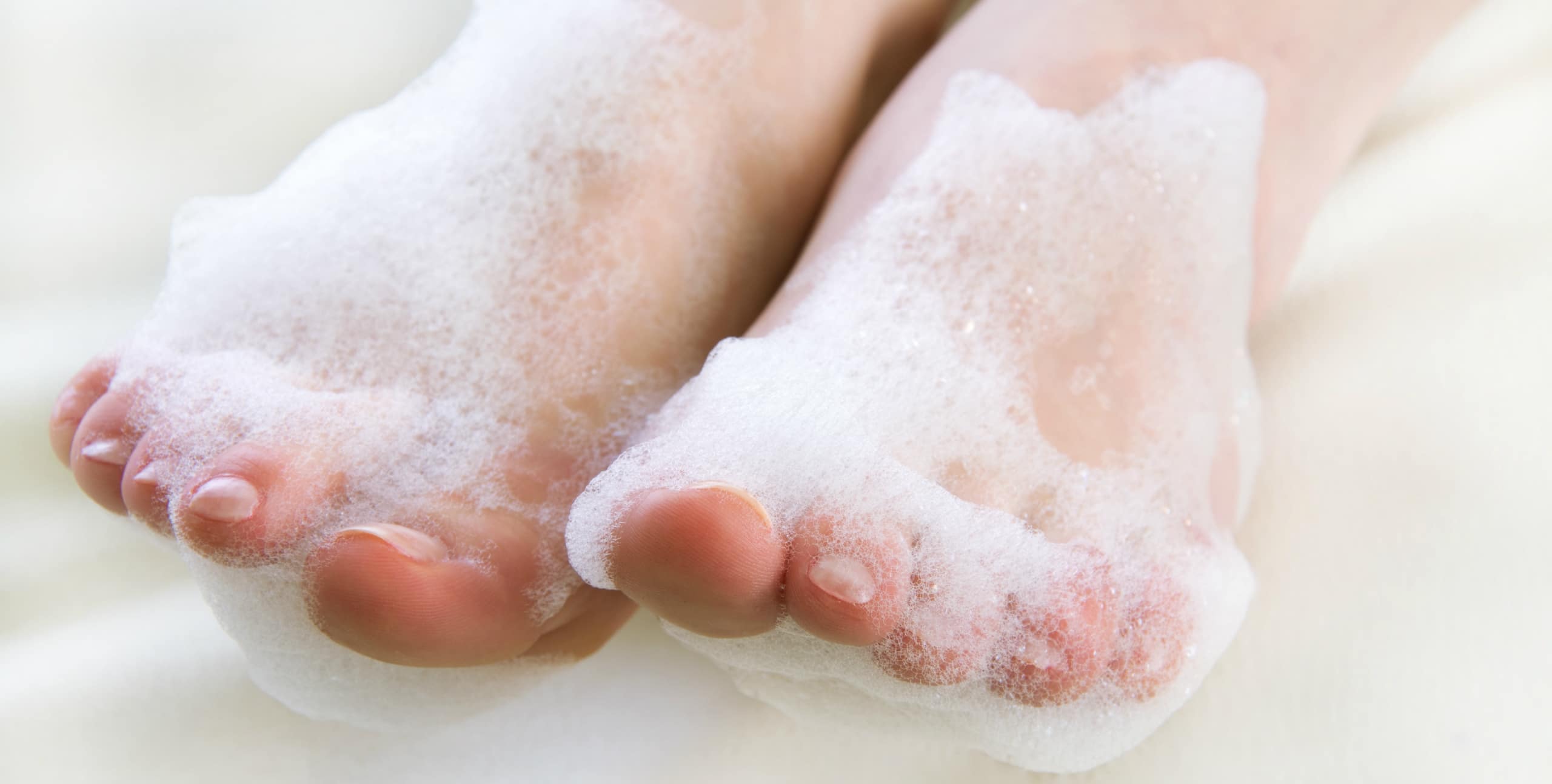 Feet in soap bubbles