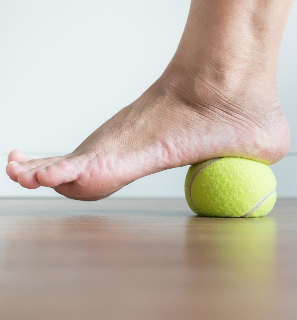 Rolling foot on tennis ball