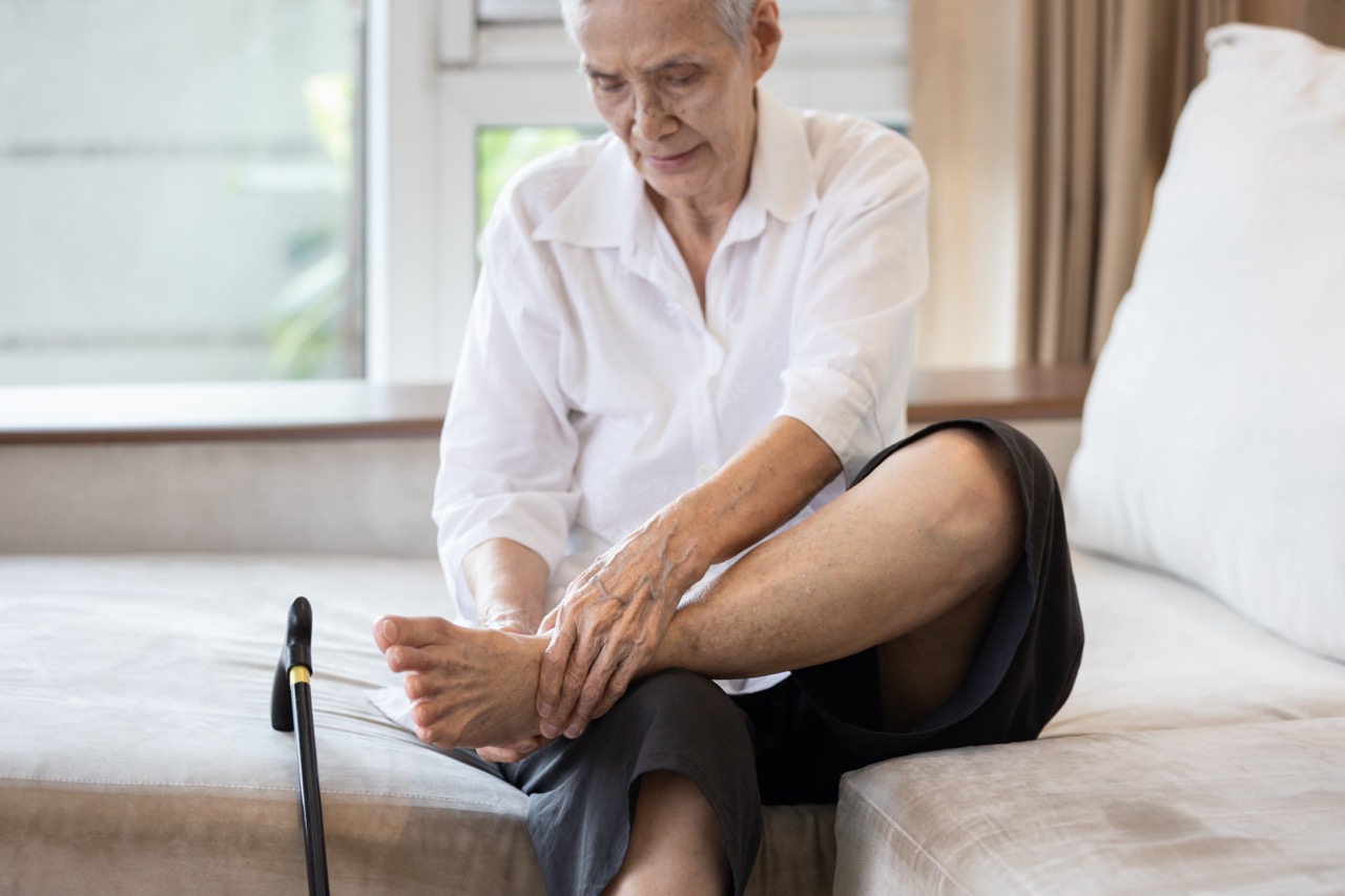 lady checking feet Neuropathy