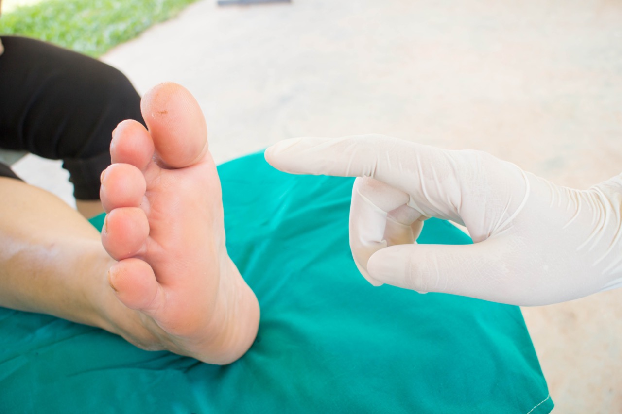 Doctor examining  feet